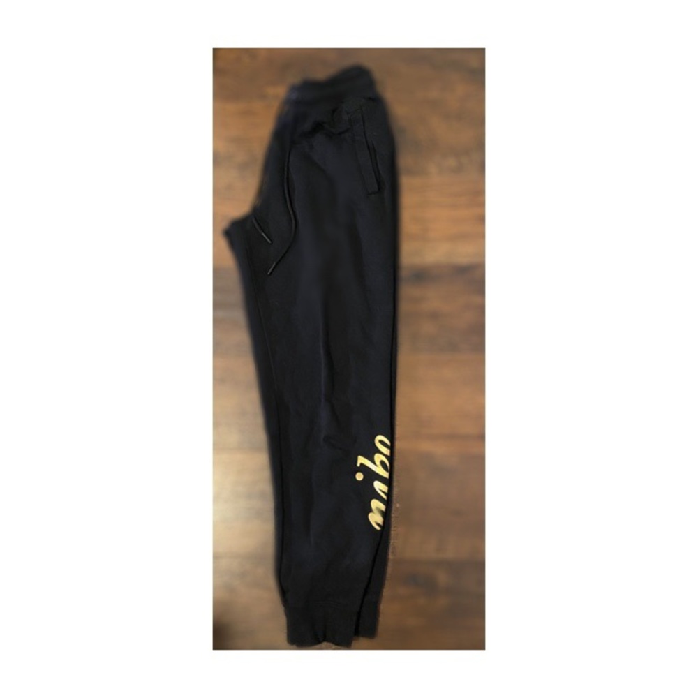 Nike joggers with gold around the ankle